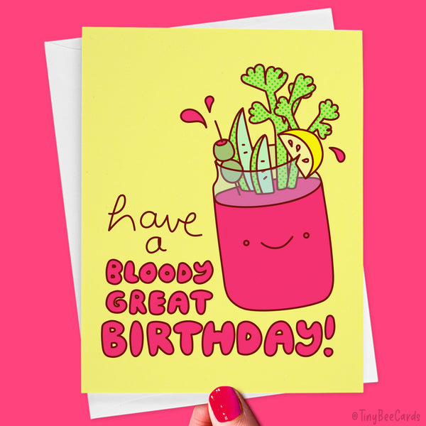 A cute kawaii bloody mary with all the fixins (celery, pickles, lemon, and olives) with the text "Have a bloody great birthday!" in red on a yellow background.