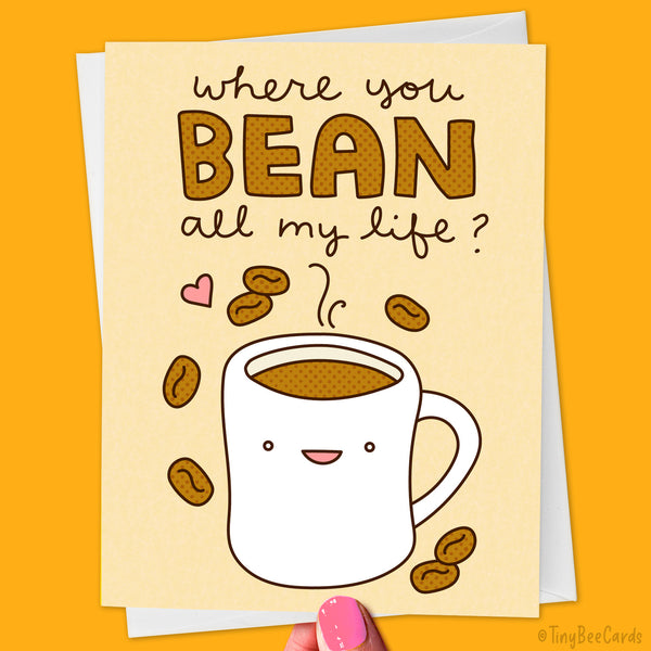 Hand drawn greeting card with a cute mug of coffee and hand illustrated text that says "where you bean all my life?" with a light brown background.