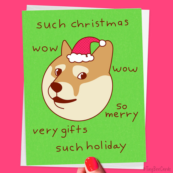 Christmas card with a hand drawn illustration of a shiba inu doge dog wearing a santa hat and text that says "such christmas, wow, so merry, very gifts, much holiday" on a green background. 