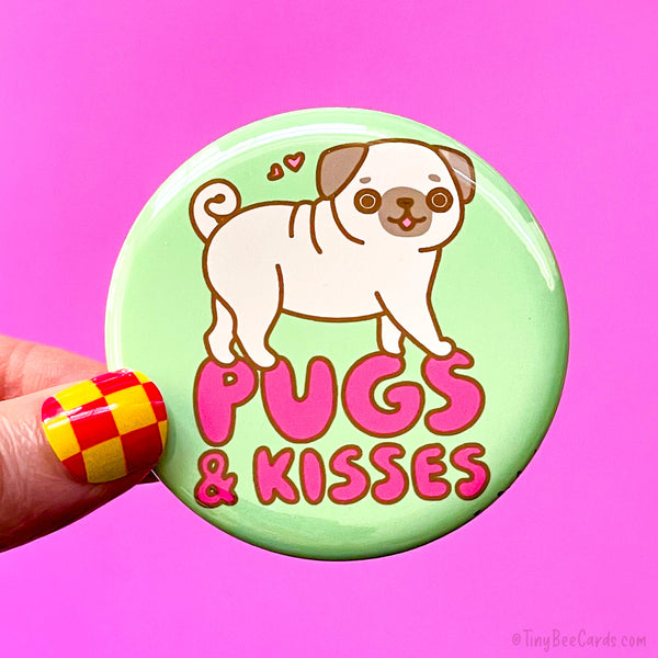Button badge with a hand drawn pug illustration and 'Pugs & Kisses' text