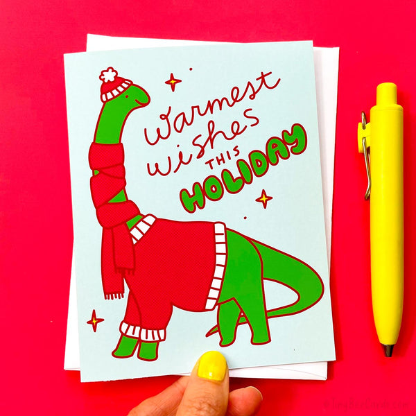 Cozy Brontosaurus Christmas Card "Warmest Wishes" - Dinosaur in Winter Scarf