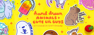 hand drawn animals and cute lil guys 
stickers, stationery, greeting cards, enamel pins, washi tape, and more gifts. Image is hand written text on a yellow background with stickers including a capybara, a cat fairy, foods and desserts, opossum, ghost, and axolotl. 